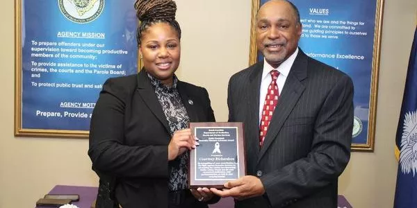 Domestic Violence Agent Courtney Richardson receiving the Keith Crossland Award.