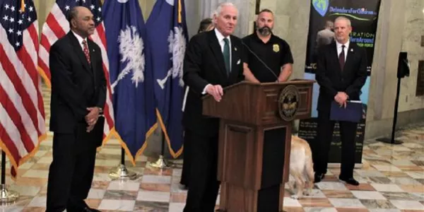 South Carolina Governor Henry McMaster giving a speech from behind a podium.
