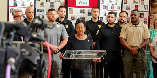 Acting Director Jodi Gallman speaking to the cameras