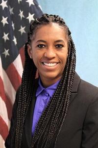 Portrait photo of Agent-In-Charge Dinah Foster in front of the American flag.